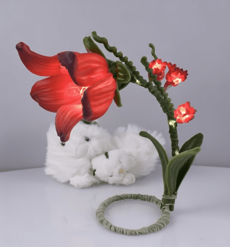 Plush white bunny with handcrafted red flower and LED blooms