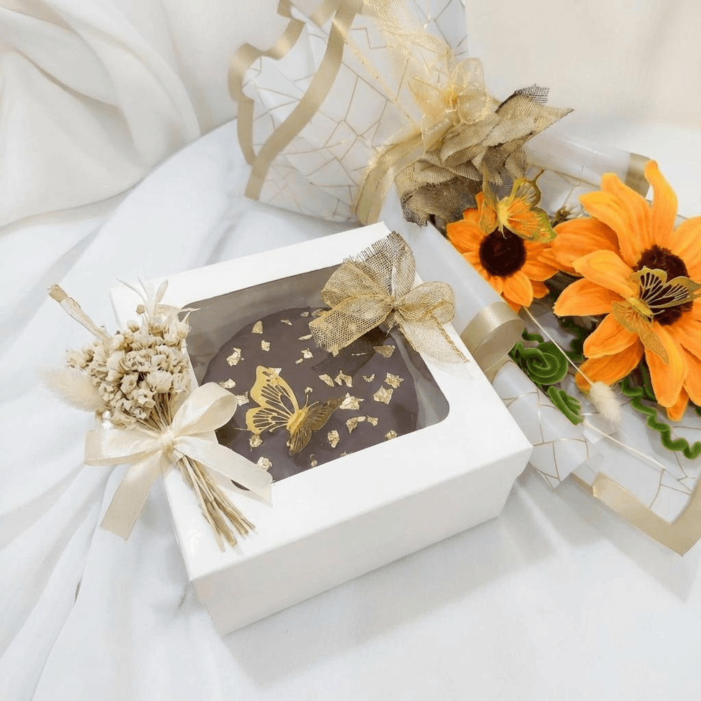 Chocolate Gift Set – A luxurious combination of cake and curated treats with flowers.