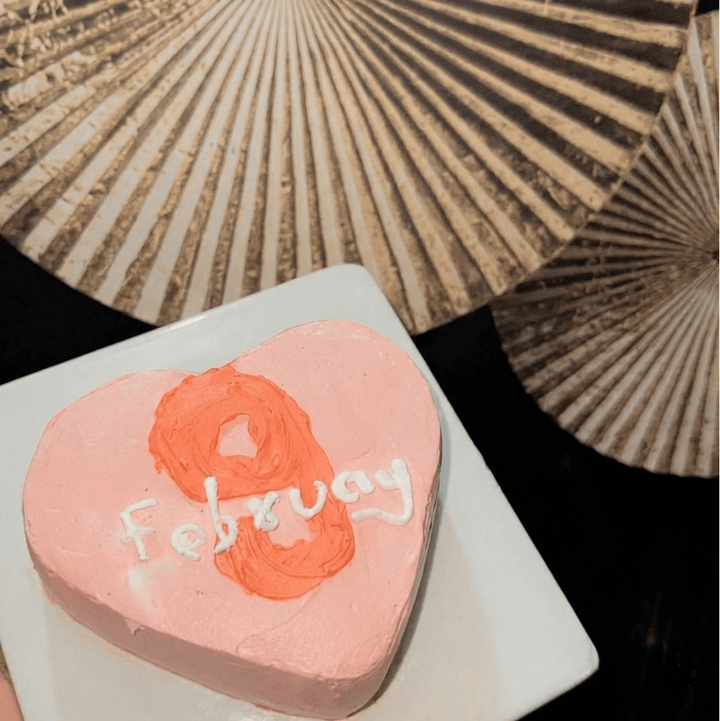 Pink heart-shaped cake with custom date decoration