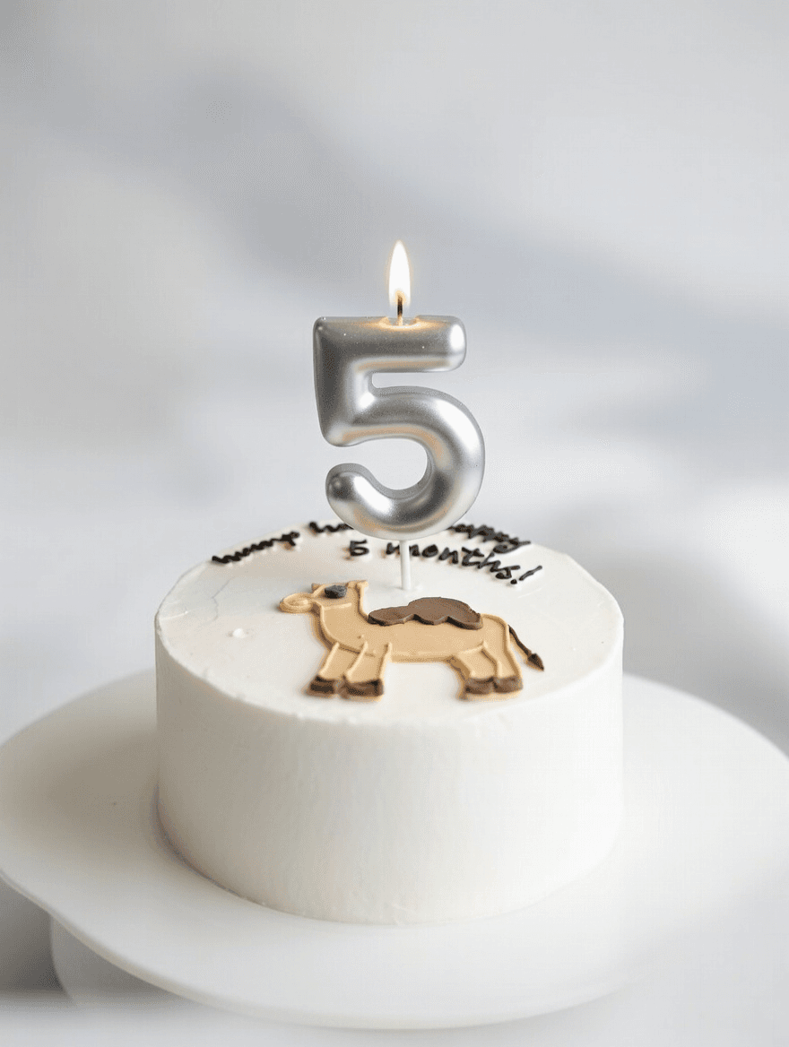 Clean white cake with fondant animal decoration and number candle