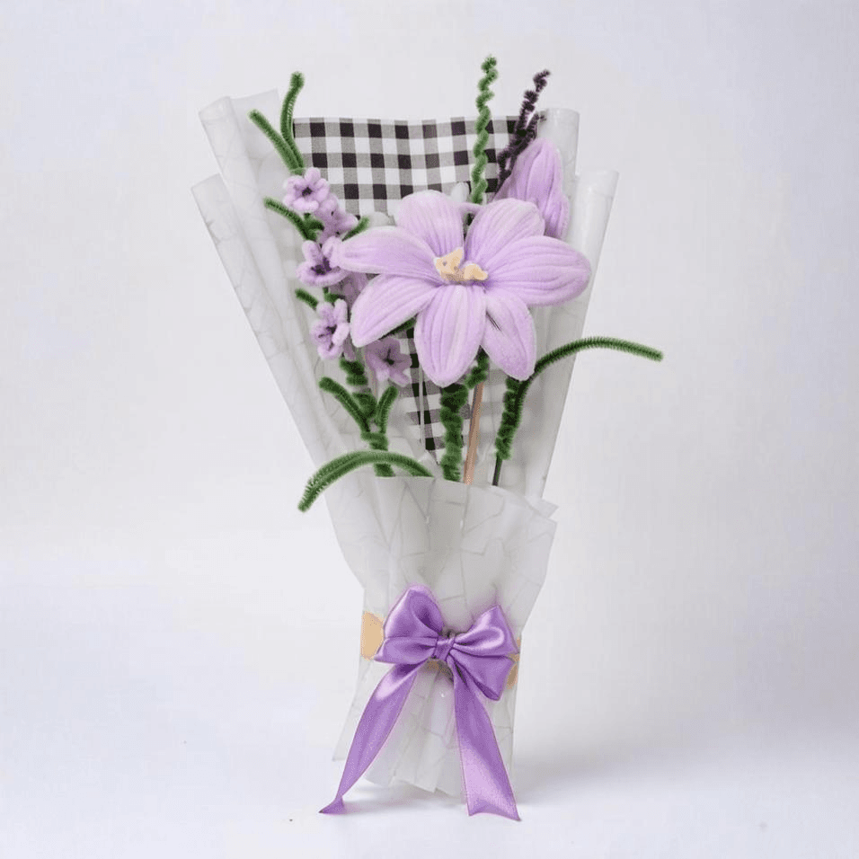 Handcrafted lavender lily bouquet with purple satin ribbon