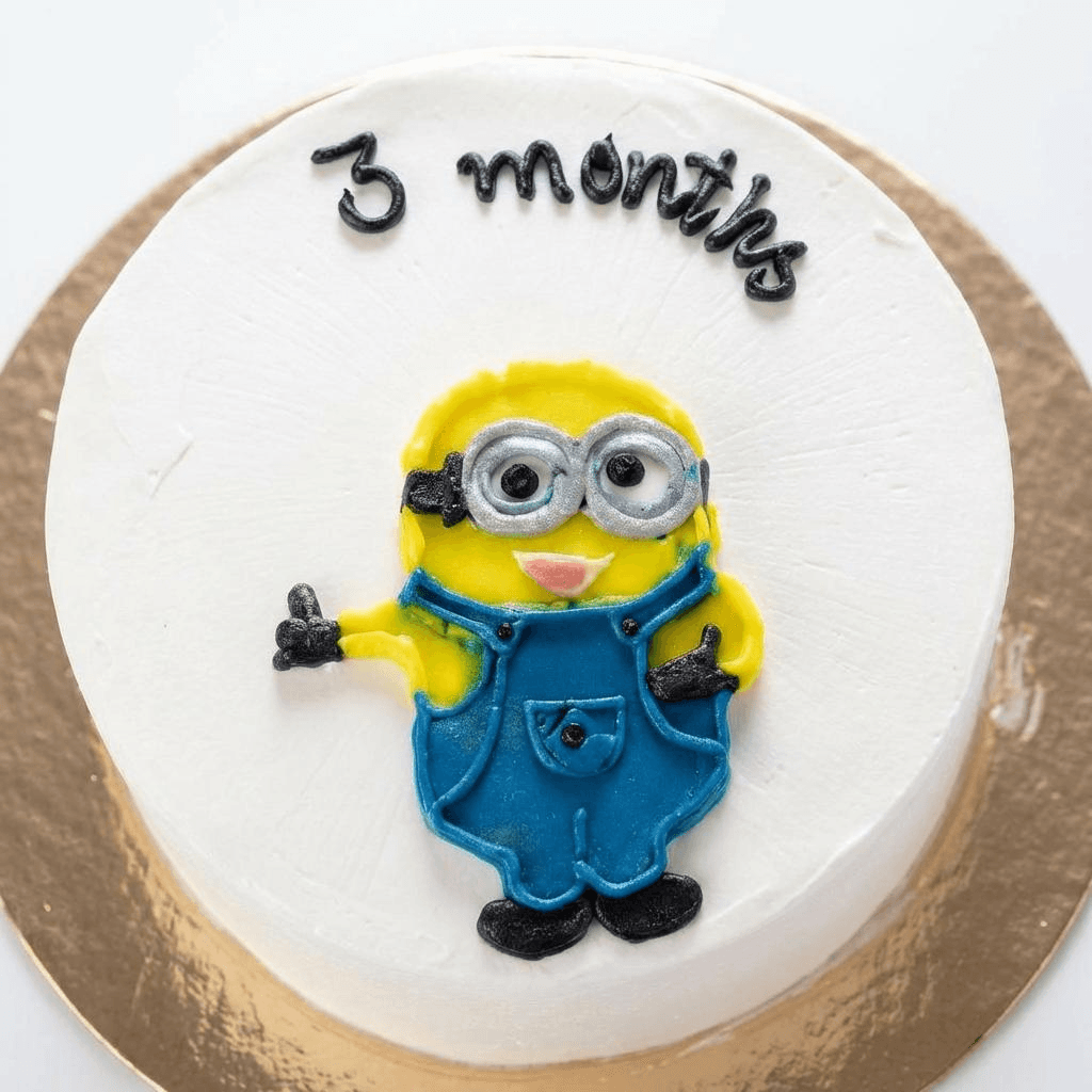 White cake with adorable Minion character decoration