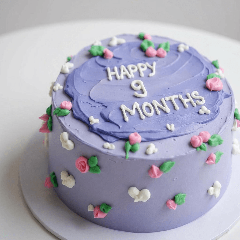 Lavender buttercream cake with pink and white flower decorations